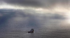 The Australian Defence Vessel Ocean Shield sails in the southern Indian Ocean as it continues to search for the missing Malaysia Airlines Flight MH370 in this picture released by the Australian Defence Force April 15, 2014. A U.S. Navy underwater drone sent to search for the missing Malaysian jetliner on the floor of the Indian Ocean had its first mission cut short after exceeding its 4.5 km (2.8 mile) depth limit, Australian search authorities said on Tuesday. REUTERS/Australian Defence Force/Handout via Reuters
