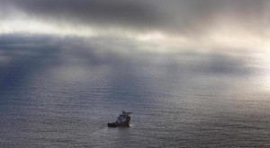 The Australian Defence Vessel Ocean Shield sails in the southern Indian Ocean as it continues to search for the missing Malaysia Airlines Flight MH370 in this picture released by the Australian Defence Force April 15, 2014. A U.S. Navy underwater drone sent to search for the missing Malaysian jetliner on the floor of the Indian Ocean had its first mission cut short after exceeding its 4.5 km (2.8 mile) depth limit, Australian search authorities said on Tuesday.  REUTERS/Australian Defence Force/Handout via Reuters