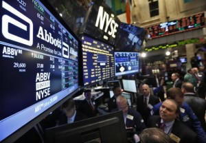 Traders gather at the booth that trades Abbott Laboratories on the floor of the New York Stock Exchange in this file photo taken December 10, 2012. Credit: Reuters/Brendan McDermid/Files