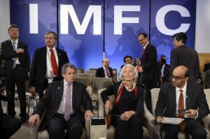  IMF Managing Director Christine Lagarde (C) takes her seat as she joins IMF First Deputy Managing Director David Lipton (L) and Singapore's Finance Minister Tharman Shanmugaratnam as they wait for the start of the International Monetary and Financial Committee (IMFC) meeting during the IMF and World Bank's 2014 Annual Spring Meetings in Washington, April 12, 2014. Credit: Reuters/Mike Theiler