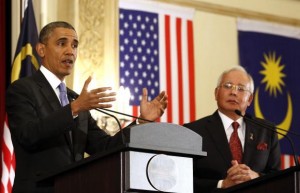 U.S. President Barack Obama speaks next to Malaysian Prime Minister Najib Razak during joint news conference at the Perdana Putra Building in Putrajaya, April 27, 2014.  Obama is set to arrive in Manila on Monday (April 28, 2014) CREDIT: REUTERS/LARRY DOWNING