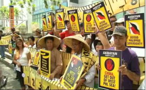 Filipino activists protest China's recent attempt to block a Philippine supply ship in the South China Sea. (Photo grabbed from Reuters video)