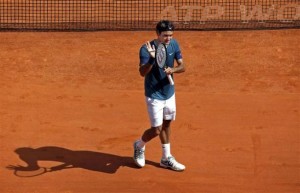 Roger Federer of Switzerland reacts after defeating Lukas Rosol of the Czech Republic during the Monte Carlo Masters in Monaco April 17, 2014. Credit: Reuters/Eric Gaillard