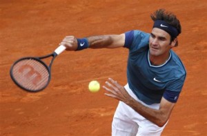  Roger Federer of Switzerland serves to Radek Stepanek of the Czech Republic during the Monte Carlo Masters in Monaco April 16, 2014. Credit: Reuters/Eric Gaillard