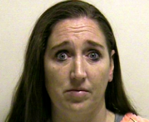 Megan Huntsman, 39, was arrested and booked into the Utah County jail on suspicion of six counts of murder early Sunday. (Courtesy Reuters)
