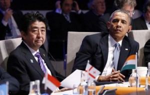  U.S. President Barack Obama (R) and Japan's Prime Minister Shinzo Abe attend the opening session of the Nuclear Security summit (NSS) in The Hague March 24, 2014. Credit: Reuters/Yves Herman