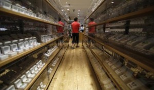 A shopper looks at earphones displayed at a mobile phone store at Tokyo's Ginza shopping district