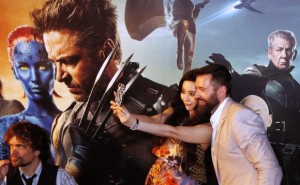 Cast members Hugh Jackman and Fan Bingbing take photos as Peter Dinklage waves to fans at the South East Asia premiere of X-Men: Days Of Future Past in Singapore