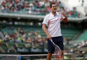 Guillermo Garcia-Lopez of Spain reacts during his men's singles match against Stanislas Wawrinka of Switzerland at the French Open tennis tournament at the Roland Garros stadium in Paris