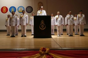 Thai Army chief General Prayuth Chan-ocha (center) is accompanied by his officers as he addresses reporters at the Royal Thai Army Headquarters in Bangkok May 26, 2014. Coup leader General Prayuth Chan-ocha said on Monday that Thailand's king had formally endorsed his position as head of the military council that will run the country. REUTERS/Damir Sagolj 