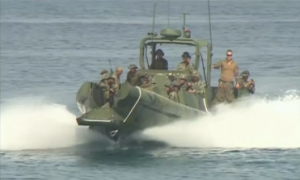 Philippines and U.S. troops board rubber boats and conduct amphibious exercises as part of the annual joint military exercise aimed at promoting security ties between nations. (Photo grabbed from Reuters video)
