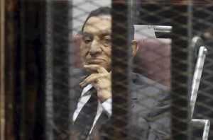 Egypt's ousted President Hosni Mubarak looks on as he reacts inside a dock at the police academy on the outskirts of Cairo May 21, 2014. An Egyptian court on Wednesday sentenced Hosni Mubarak to three years in prison on charges of stealing public funds. REUTERS/Stringer