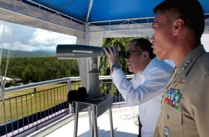 President Benigno S. Aquino III checks out the view of the West Philippine Sea from the administration building of Philippine Navy headquarters in Palawan during the 116th Anniversary of the Philippine Navy at the open grounds of the Naval Forces West naval station Carlito Cunanan in Barangay Macarascas, Puerto Princesa City, Palawan on Tuesday (May 27). With the theme: “Protecting our Territory, Safeguarding our Future,” it is the first time in the Philippine Navy history for its anniversary to be held at the naval operating forces station. This is to showcase the Philippine Navy’s future plans of developing and improving its forward operating base in Palawan, facing the West Philippine Sea. (Photo by Gil Nartea / Malacañang Photo Bureau)