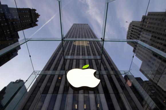 The leaf on the Apple symbol is tinted green at the Apple flagship store on 5th Ave in New York April 22, 2014. Employees and signage have been themed green to mark Earth Day. CREDIT: REUTERS/BRENDAN MCDERMID