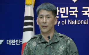 South Korean chief of public affairs of Joint Chiefs of Staff (JCS), Eom Hyo-sik announces in a news briefing that North Korean artillery fires at least one shot which landed near a South Korean navy patrol ship at the disputed maritime border, but did not hit the vessel.  (Photo grabbed from Reuters video)