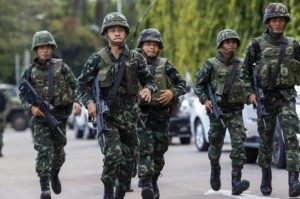 Thai soldiers run as they take their positions during a coup at the Army Club where Thailand's army chief held a meeting with all rival factions in central Bangkok May 22, 2014. CREDIT: REUTERS/ATHIT PERAWONGMETHA
