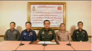 General Prayuth Chan-ocha, commander in chief of the Royal Thai Army, flanked by fellow military leaders, appeared on all major television stations late Thursday afternoon and declared the military and police were now running the country's government. (Photo grabbed from Reuters video)
