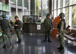 Thai soldiers occupy the foyer of the National Broadcasting Services of Thailand television station in Bangkok May 20, 2014.Thailand's army declared martial law on Tuesday to restore order after six months of anti-government protests which have left the country without a functioning government.The declaration did not constitute a coup and was made in response to deteriorating security, an army general said. REUTERS/Athit Perawongmetha