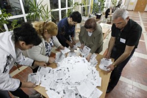 Members of a local election commission sort ballots as they start counting votes of today's referendum on the status of Luhansk region in Luhansk May 11, 2014. Pro-Moscow rebels expressed confidence eastern Ukraine had chosen self-rule in a referendum on Sunday, while differing on what that meant as fighting flared in a conflict that could pitch Russia and the West into a new Cold War.   REUTERS/Valentyn Ogirenko
