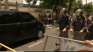 A black van believed to be carrying ousted Thai Prime Minister Yingluck Shinawtra, enters a tightly secured road on the way for talks called for by the Thai army chief on Friday, May 23. (Photo grabbed from Reuters video)