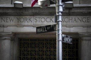 The Wall St. sign is seen outside the door to the New York Stock Exchange in New York's financial district February 4, 2014. Credit: Reuters/Brendan McDermid