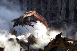  A crane lifts rubble from the ruins of the World Trade Center in New York, October 12, 2001. Smoke continues to pour from ground zero over a month after the collapse of the towers after being struck by hijackedaircraft. Credit: Reuters/Brad Rickerby 