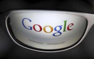 A Google search page is reflected in sunglasses in this photo illustration taken in Brussels May 30, 2014. Credit: Reuters/Francois Lenoir