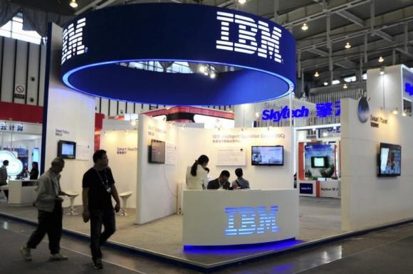 Visitors walk past the IBM booth at the 9th China International Software Product & Information Service Expo in Nanjing, Jiangsu province September 6, 2013. Credit: Reuters/China Daily