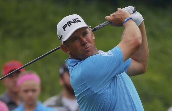 Lee Westwood of England watches his tee shot on the 16th hole during the first round of the 2014 PGA Championship at Valhalla Golf Club in Louisville