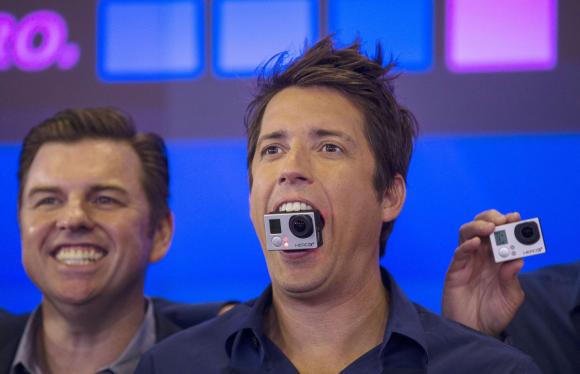 GoPro Inc's founder and CEO Nick Woodman holds a GoPro camera in his mouth at GoPro Inc's IPO at the Nasdaq Market Site in New York City in this file photo taken June 26, 2014. Credit: Reuters/Mike Segar/Files
