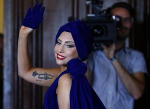 U.S. singer Lady Gaga leaves after a news conference, ahead of her concert with Tony Bennett, in Brussels