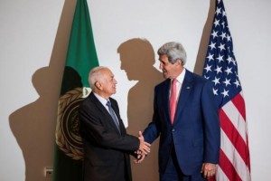 Arab League Secretary-General Nabil al-Araby (L) and U.S. Secretary of State John Kerry shake hands before a meeting in Cairo September 13, 2014. REUTERS/Brendan Smialowski/Pool