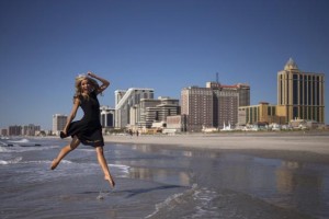 Newly-crowned Miss America 2015 Kira Kazantsev leaps into the air while posing for photographs during her ''Toe Dip' along the beachfront of Boardwalk Hall the morning after she won the 2015 Miss America Competition in Atlantic City, New Jersey September 15, 2014. Credit: Reuters/Adrees Latif
