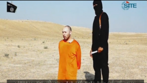 A photo grabbed from the video released by the Islamic State militant group on Tuesday (Sept.1) purporting to show the beheading of a second American hostage, journalist Steven Sotloff. (Courtesy Reuters/photo grabbed from Reuters video)