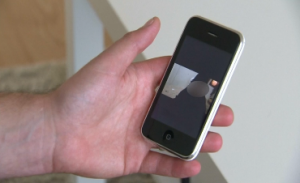 A French man interviewed by Reuters shows a cellphone photo of his sister who has been lured into the Islamist State in Syria. (Photo grabbed from Reuters video/Courtesy Reuters)