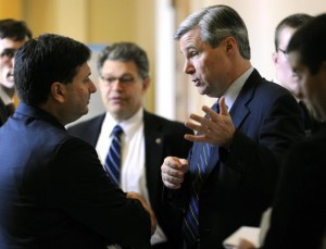 U.S. Senator Sheldon Whitehouse (D-RI) (R) talks to Ron Klain (L), then-Chief of Staff for U.S. Vice President Joe Biden, outside of the senate Democrats' weekly policy lunch at the U.S. Capitol in Washington, in this December 8, 2009 file photo.REUTERS/Jonathan Ernst/Files