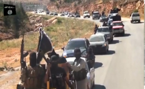Various of so-called fighters on the road.  (Photo grabbed from  social media website production of ISIL-ISLAMIC state in Iraq and the Levant/ Courtesy Reuters )