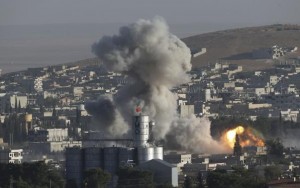 Smoke rises after an U.S.-led air strike in the Syrian town of Kobani Ocotber 10, 2014. REUTERS/Umit Bektas