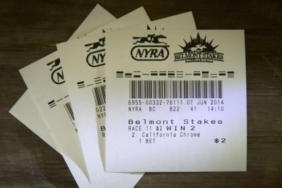 Wager tickets are pictured on a table in this photo illustration before the 146th running of the Belmont Stakes in Elmont, New York June 7, 2014. CREDIT: REUTERS/CARLO ALLEGRI