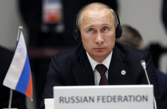 Russia's President Putin attends the closing ceremony of Europe-Asia summit in Milan