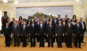 China's President Xi Jinping (C) poses for photos with the guests at the Asian Infrastructure Investment Bank launch ceremony at the Great Hall of the People in Beijing on October 24, 2014. (Reuters/Takaki Yajima)