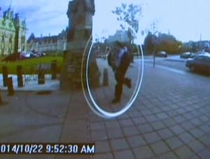 A man identified by Royal Canadian Mounted Police as Michael Zehaf-Bibeau is seen October 22, 2014 as he exits a car and runs toward the Parliament buildings in a still image taken from surveillance video released by the RCMP October 23, 2014.   REUTERS/CBC via Reuters TV