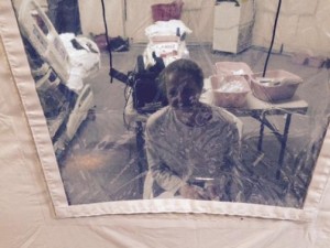 Kaci Hickox speaks to her lawyer Norman Siegel from a hospital quarantine tent in Newark, New Jersey, October 26, 2014. REUTERS/Steve Hyman/Handout via Reuters