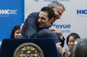 New York Mayor Bill de Blasio hugs Dr. Craig Spencer as he is discharged from Bellevue Hospital after being stricken by Ebola in New York