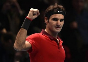 Roger Federer celebrates defeating Kei Nishikori in their tennis match at the ATP World Tour finals in London