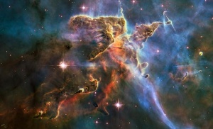 This NASA Hubble Space Telescope image captures the tempestuous stellar nursery called the Carina Nebula, located 7,500 light-years away from Earth in the southern constellation Carina. The image celebrates the 20th anniversary of Hubble's launch and deployment into an orbit around Earth. Hubble's Wide Field Camera 3 observed the pillar on Feb. 1-2, 2010.   REUTERS/NASA/Handout