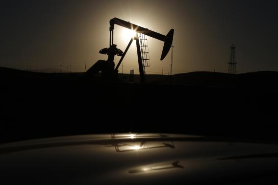 A pump jack is seen at sunrise near Bakersfield, California October 14, 2014. CREDIT: REUTERS/LUCY NICHOLSON