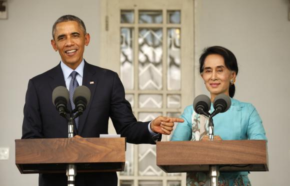 U.S. President Barack Obama and opposition politician Aung San Suu Kyi hold a press conference after their meeting at her residence in Yangon, November 14, 2014. CREDIT: REUTERS/KEVIN LAMARQUE