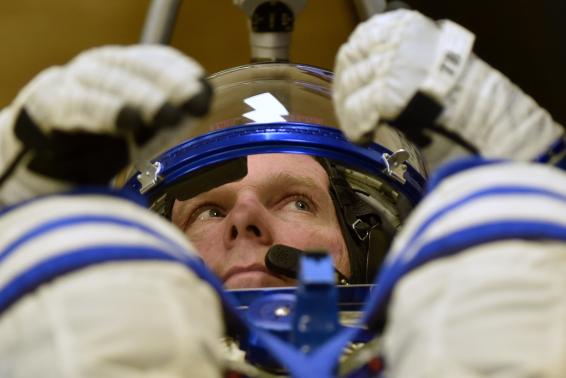 International Space Station (ISS) crew Terry Virts of the U.S. gestures during a space suit test at the Baikonur cosmodrome November 23, 2014. REUTERS/Kirill Kudryavtsev/Pool