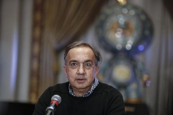 Sergio Marchionne, chief executive officer of Fiat Chrysler Automobiles, speaks with the media before ringing the closing bell to celebrate the company's listing at the New York Stock Exchange, October 13, 2014. REUTERS/Eduardo Munoz